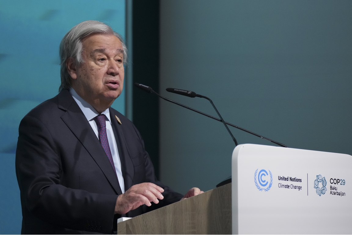 Antonio Guterres speaking from behind a podium at a UN climate conference