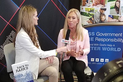 Veronika Kyrylenko interviews Congresswoman Marjorie Taylor-Greene at The John Birch Society booth at CPAC. The JBS is the parent organization of The New American.