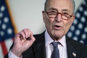 Schumer Caught in Middle as Left Rails Against Sinema, Manchin